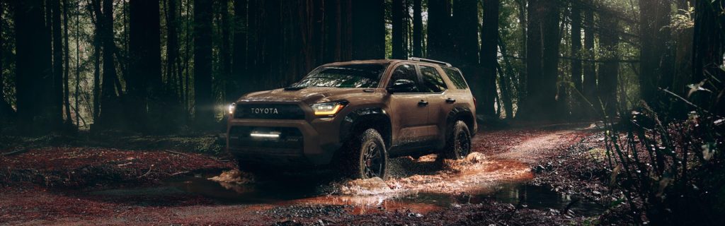 All-new brown 2025 Toyota 4Runner driving in forest