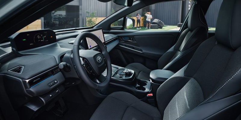 Toyota C-HR interior cockpit view with steering wheel, center console, and dashboard.